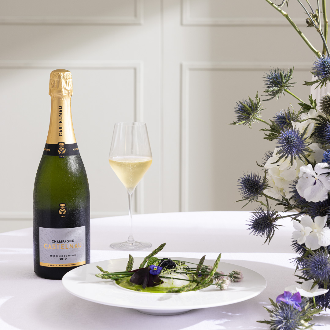 Blanc de Blancs 2010 champagne bottle with a food pairing